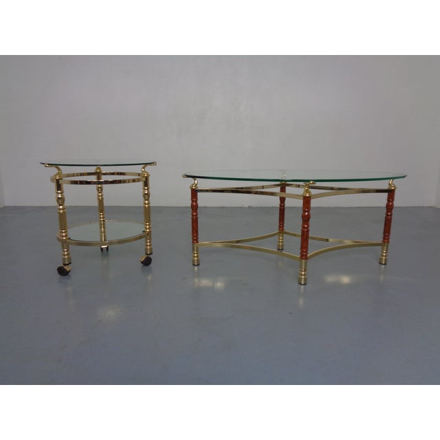 Two tables with loose glass tops from the 1970s. The smaller table is on casters. Dimensions of the round, casters-on...