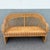 A beautifully crafted Vintage Boho Chic woven wicker loveseat featuring an elegant sculptural silhouette and intricate...