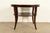 An elegant modern Regency or Art Deco style dark mahogany two-tier game table or center table By Barbara Barry for Baker...