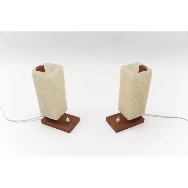 A pair of scandinavian table lamps made in teak and acrylic granulate, 1960s the lamp needs each 1 x e14 / e15 edison...