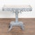 Small pine side table with decorative skirt and pedestal base. Restored, later professionally painted in layered shades of...