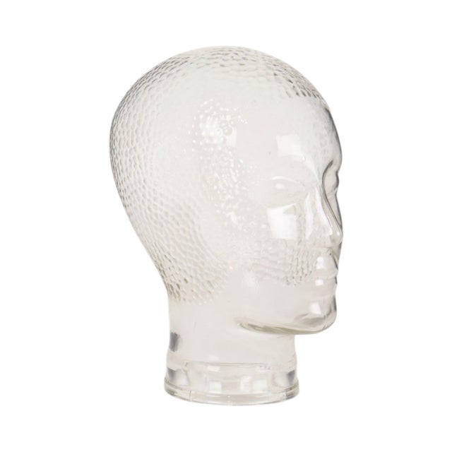 Cool vintage shop display mannequin head made of transparent pressed glass, featuring anti-slip studs on the crown; dates...