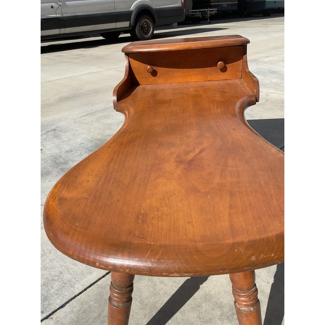 A wonderful late 19th-century American cobbler’s bench featuring the classic sculptural boot-shaped work surface, raised...