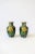 A beautiful pair of vintage black and yellow Asian Cloisonné enamel and brass vases, circa early to mid- 20th century....