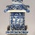 This striking porcelain pagoda features tiered upturned eaves and hand-painted blue-and-white detailing. The rectangular...