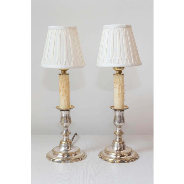 This exquisite pair of 19th-century candlesticks, crafted from silvered and chiseled bronze, has been beautifully...