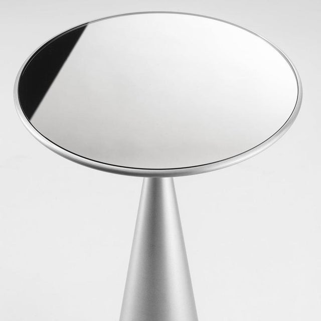 A sculptural side table by Lorenza Bozzoli, defined by a pure conical silhouette and a striking contrast between mass and...