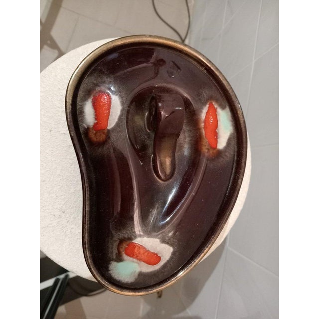 Three-piece set consisting of a small jug-shaped vase, a candy bowl, and a three-candle candelabra. candelabra w30 d7 h11...