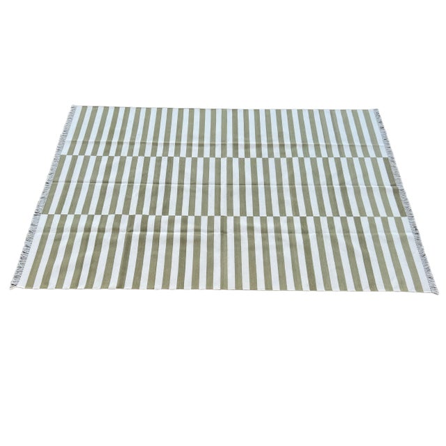 Cotton Vegetable Dyed Olive Green and White Striped Rug-10'x14'. These special flat-weave dhurries are hand-woven with 15...