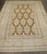 An early 20th Century Indian Larestan Rug with an all-over large scale plant vase pattern on a brown field