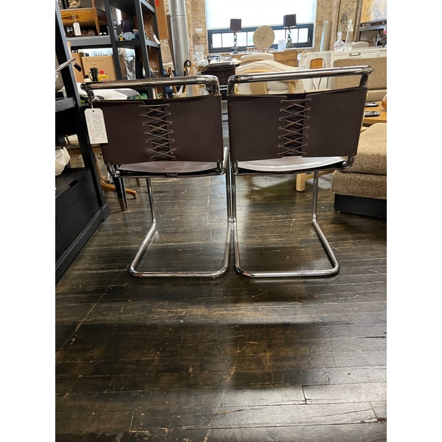 1970's Spoleto Dining Chair attributed to Knoll with original brown leather seats and backs. Unmarked. Some laces were...