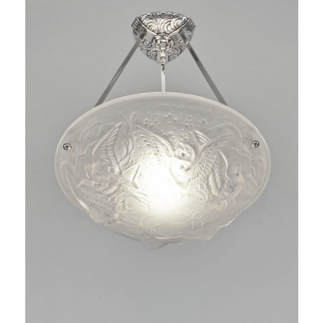MULLER FRERES A nice French 1925-1935 art deco pendant light in nickel plated solid brass or bronze. The mount holds a...
