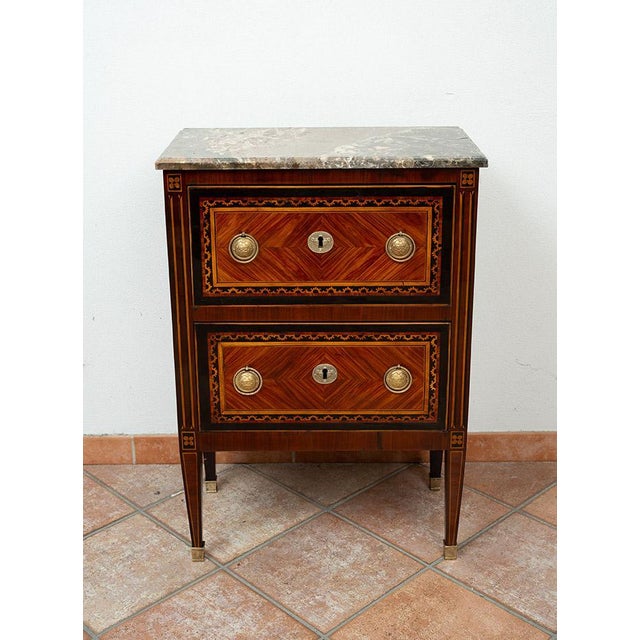 Antique Neapolitan Louis XVI small chest of drawers with a marble top, crafted from fine exotic woods, dating from the...