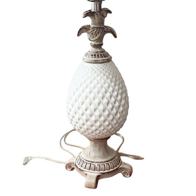 Late Mid-Century Pineapple lamp crafted in ceramic with a taupe and white finish. The body of the lamp is made of a...