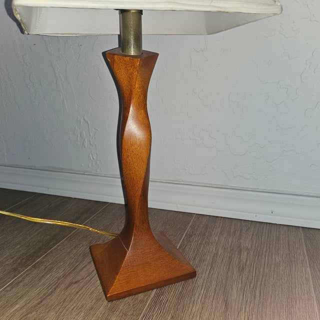 I love how elegant the twisted wood looks like an evening gown. 5"x5" base. 23" tall. It's not the original lampshade.