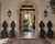 A striking set of four antique Italian Renaissance Revival hall chairs crafted from richly toned walnut and adorned with...