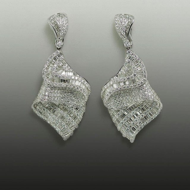 18k White gold Earrings containing 17.83 carats of round and baguette cut diamonds. 37.34 grams