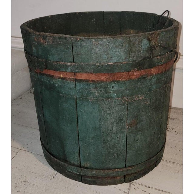19Thc Original Blue /green painted sap bucket from New England with the original handle.The interior of the bucket has a...