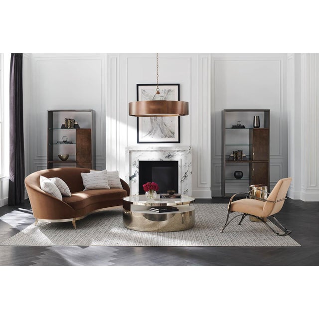 With an iconic kidney shape, this sumptuous sofa offers enveloping comfort in a warm caramel-colored velvet. Its...