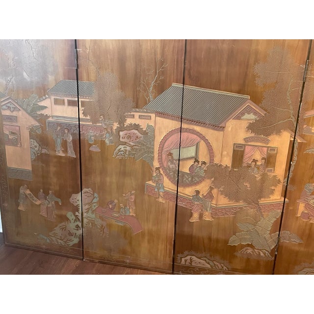 Screen made in Hong Kong. Has an etched pavilion landscape scene.