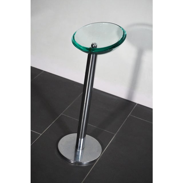 Very elegant freestanding ashtray in glass and polished steel that can also be used as a tray. I have official proof of...