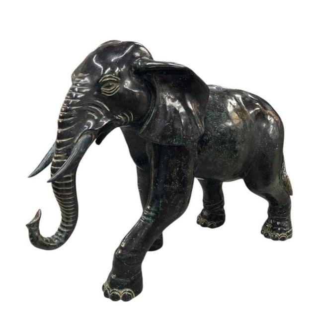 Exuding timeless elegance and classic grandeur, this impressive vintage Italian bronze elephant sculpture is a commanding...