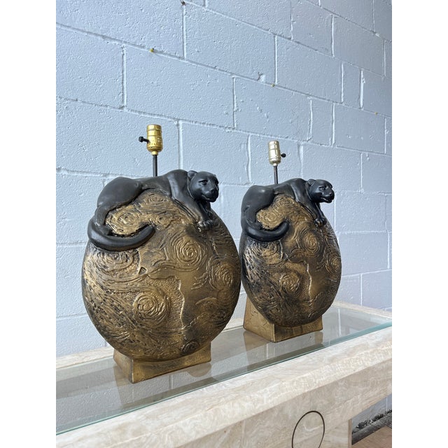 A dramatic pair of vintage sculptural table lamps executed in the glamorous Hollywood Regency manner of the 1970s and...