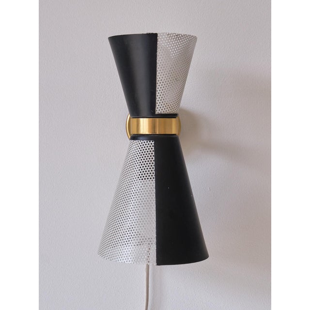 This rare pair of wall lights was produced by Falkenbergs Belysning in Sweden in the 1960s. The lamps are marked with the...