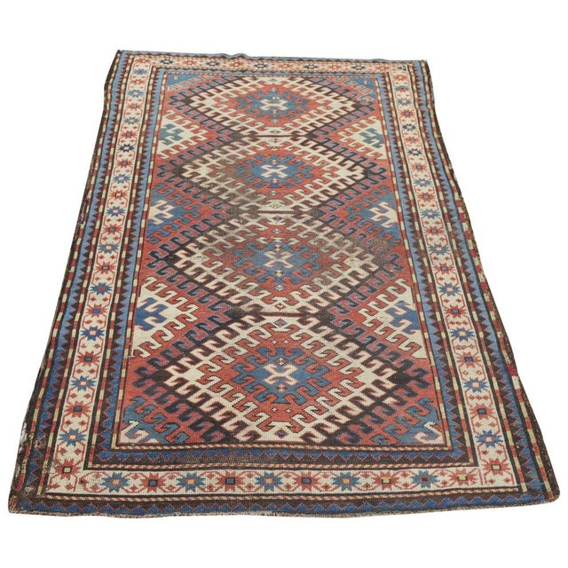 Hand-knotted with care using traditional rug-making techniques, this wool rug blends timeless craftsmanship with a modern...