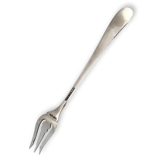 An elegant antique Schofield sterling silver pickle fork in the coveted Baltimore Rose pattern, beautifully decorated with...