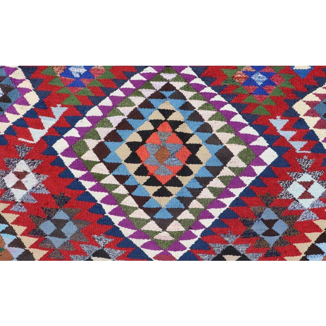 Measures:9'1 x 16'0 Hand woven Vintage Qashqai Persian Kilim Rug With Bold Geometric Diamonds in Red, Blue, and Multicolor...