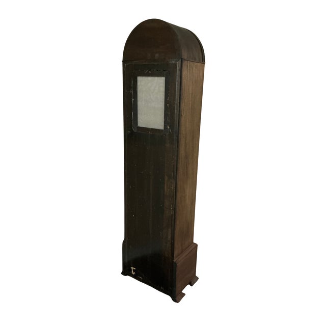 A handsome vintage Herschede Hall grandfather clock featuring a beautifully proportioned walnut case with arched bonnet...