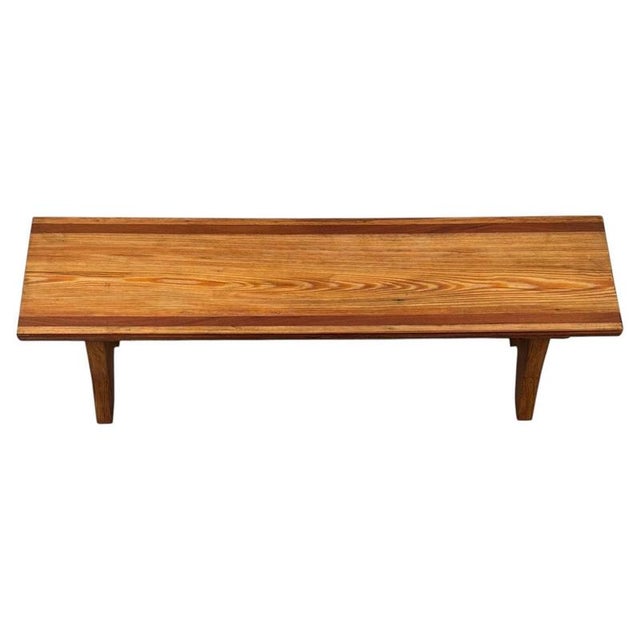 A charming and particularly well-crafted early 20th-century English bench, constructed in richly grained pitch pine and...
