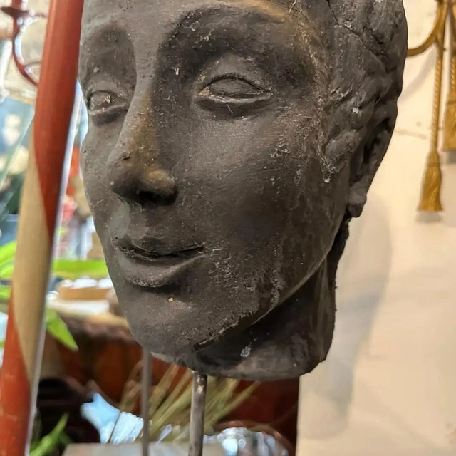 A black painted clay head handcrafted in Sicily in the late 19th century, the head it's in original condition and shows...