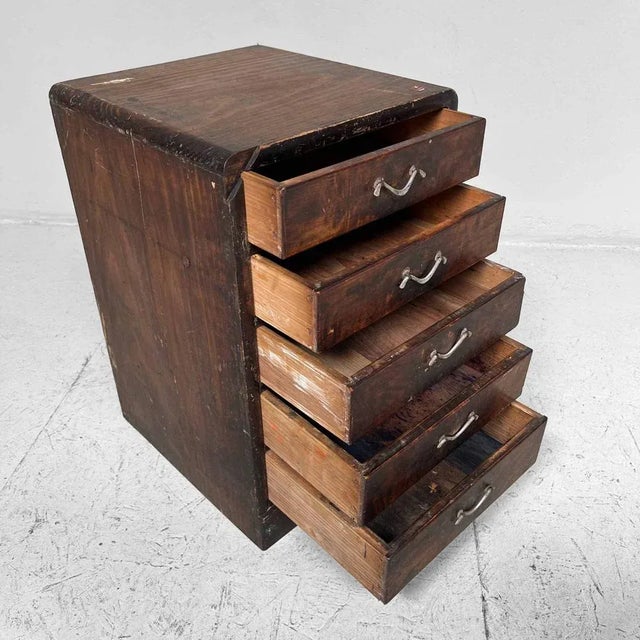 Antique chest of drawers from the early 1900s with five drawers. This tansu has served to house calligraphy material, some...
