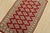 A tribal Bokhara Jaldar rug hand-knotted with fine wool on a cotton foundation. This rug features rows of repeating...