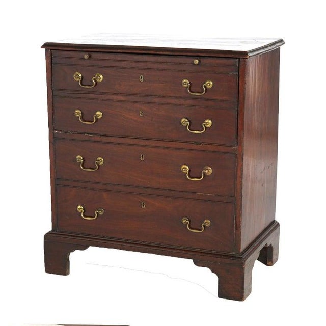 An early antique English Georgian secretary offers lift top and drop-down desk over two long drawers, circa 1750 Measures...