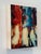 Streets of Hope 3 captures the essence of urban life through the blurred figures of pedestrians moving through a vibrant...
