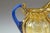 Murano glass pitcher in a Liberty-inspired vocabulary, worked in blue and yellow with floral decoration, optic ribs and...