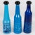 This rare set of three stunning colored glass bottles was designed by Salvador Dali (1904 - 1989) for Rosso Antico, Ltd,...