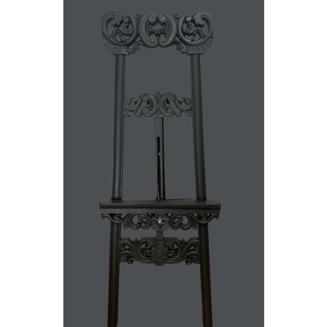 Carved wood art display easel. Restored and freshly painted in Ash. Open measures 16x28.5x42