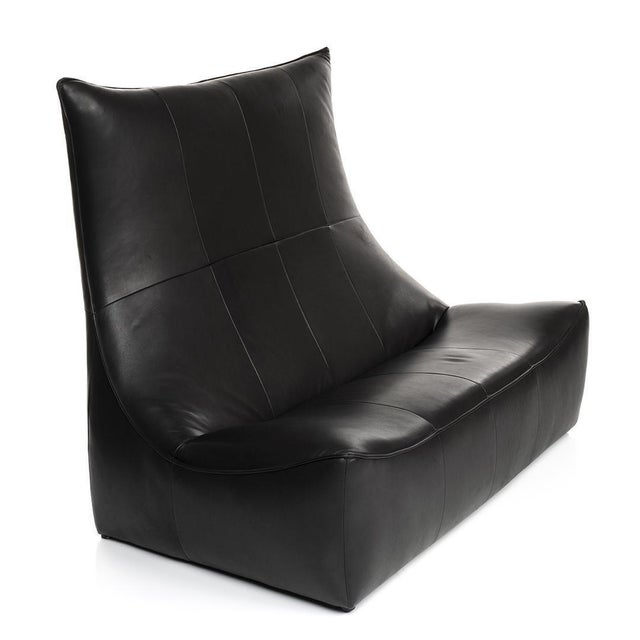 A wonderful two-piece set of sitting consisting of a loveseat and a single lounge chair by Gerard Van Den Berg (b. 1947)....
