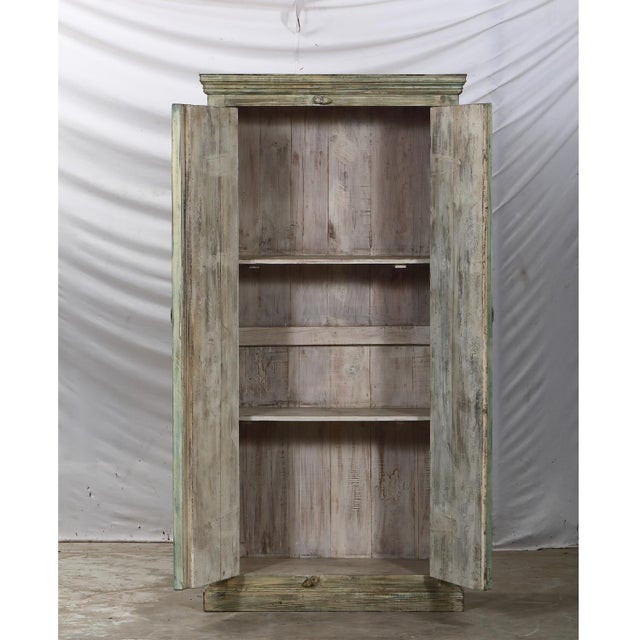 Crafted from vintage Indian painted teakwood doors, c. 1920-50, and reclaimed architectural elements, this armoire blends...