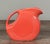 Vintage Fiesta Ware ceramic disc pitcher by Homer Laughlin, produced in the United States and marked on the underside....