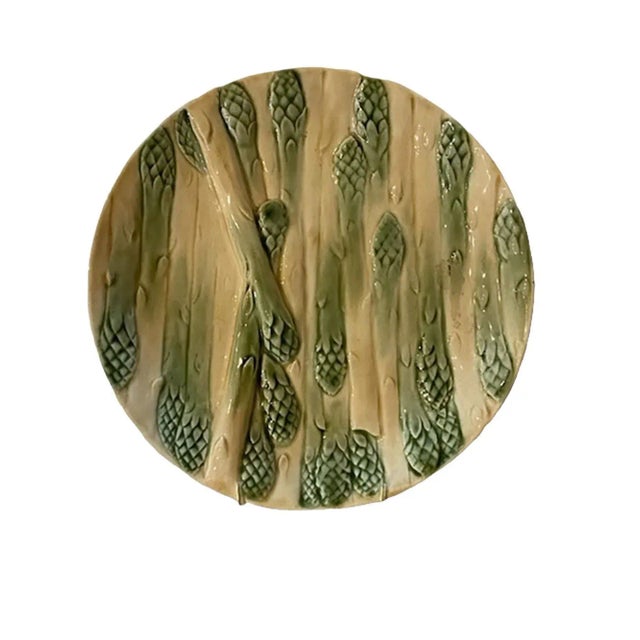 A 19th century French majolica asparagus plate with a stack of asparagus. Circa 1890, France.