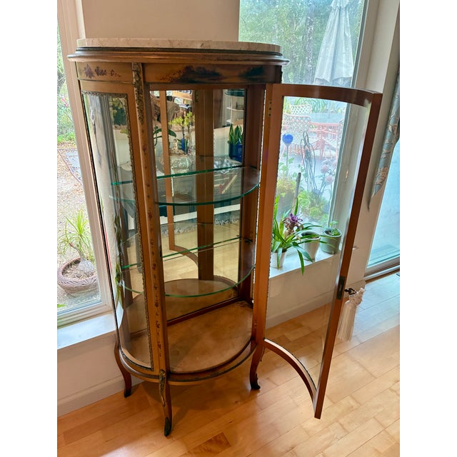 French style vitrine, enclosed-glass display cabinet. Stone marble top. Painted antique finish. Cabriole legs. Curved...
