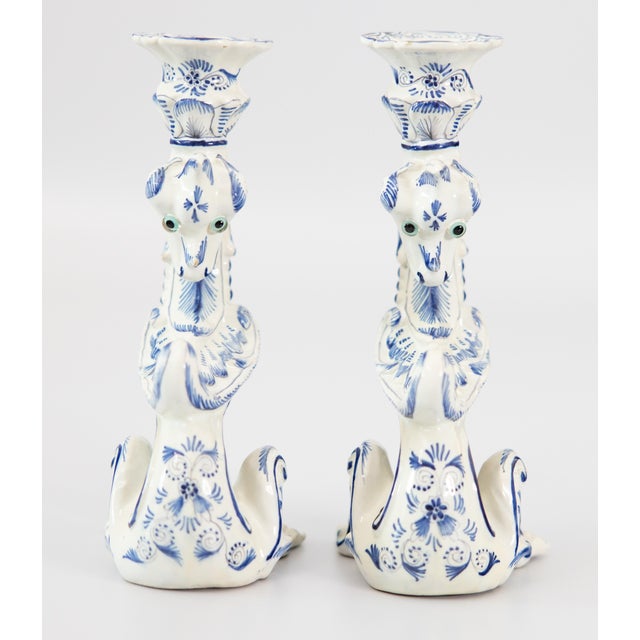 A rare pair of vintage Dutch Delft faience dragon candlesticks in cobalt blue and white, circa 1930. Marked "Delft" on...