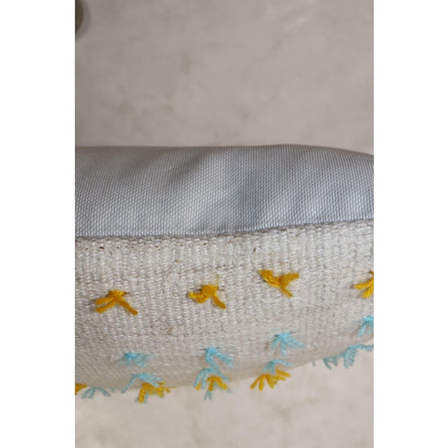 Pillow made from hemp turkish kilim with yellow and blue wool flaring out