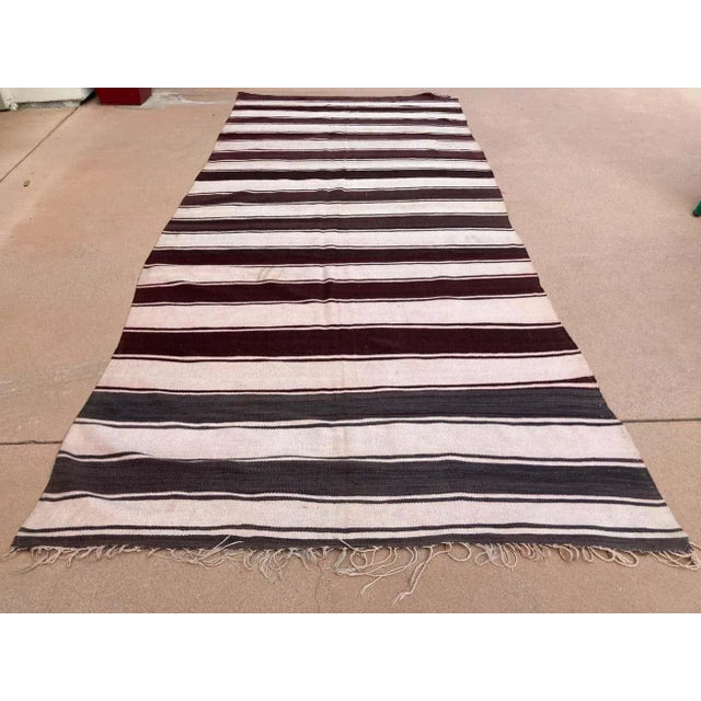 Large handwoven vintage Moroccan Berber Tribal kilim rug. Handwoven by the Berber tribes in south Morocco with traditional...