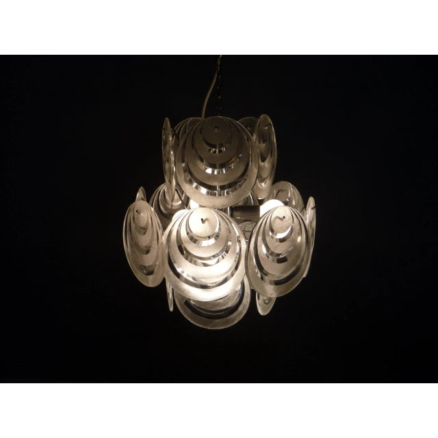 Space age ceiling lamp from the sixties. Chromed metal lamp frame. 18 acrylic glass plates are simply attached. The lamp...